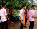 Male students don saffron shawls to oppose burqas in college