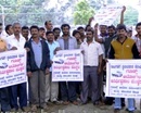 Hassan: Goods Tempo Owners & Drivers stage Protest to allow Parking at Near Suvarna Hotel