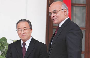 China looking to build ties with neighbours after transition, Dai tells Menon